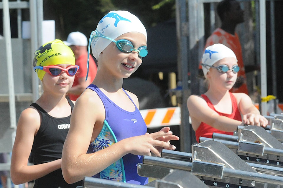 Swimmers prepare to take their marks at the start of the Langley Flippers Swim Club annual invitational, held July 2-3 at Al Anderson Pool for the first time since 2019. (Dan Ferguson/Langley Advance Times)