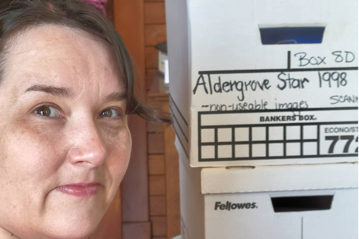 Brenda Haid, vice-president of the Alder Grove Heritage Society, was sorting some of the donated photos from the Aldergrove Star on Sunday, July 24. On Saturday, August 13, the museum will host Heritage Day from 11 a.m. to 4 p.m. (Dan Ferguson/Black Press Media)