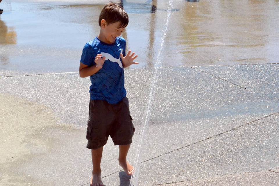 Milo Zuriti and his cousins are visiting their grandmother in South Surrey from Okanagan to get some relief from rising temperature. That included a visit to the Willoughby spray park Wednesday, July 27, 2022. (Tanmay Ahluwalia/Langley Advance Times)