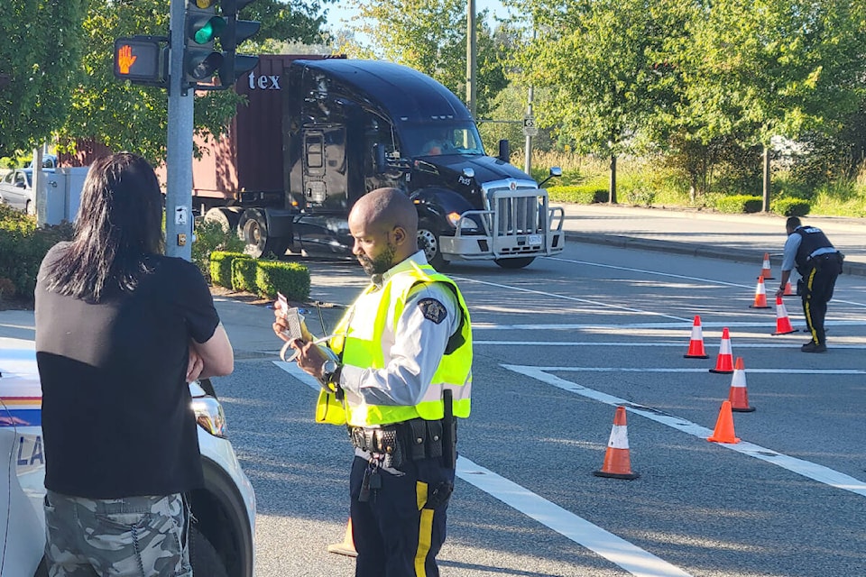 30015721_web1_220808-LAT-DF-Pedestrian-hit-police-at-scene_1