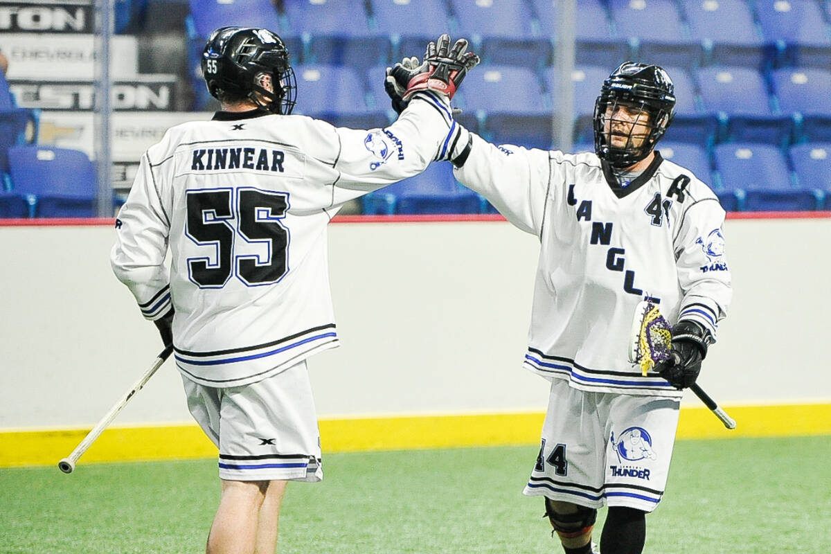 Langley Thunders Dylan Kinnear high-fived Dane Dobbie as the WLA team moved within one game of clinching the series, recording a 12-11 overtime victory on Tuesday night at Langley Events Centre. (Photo courtesy Langley Events Centre)