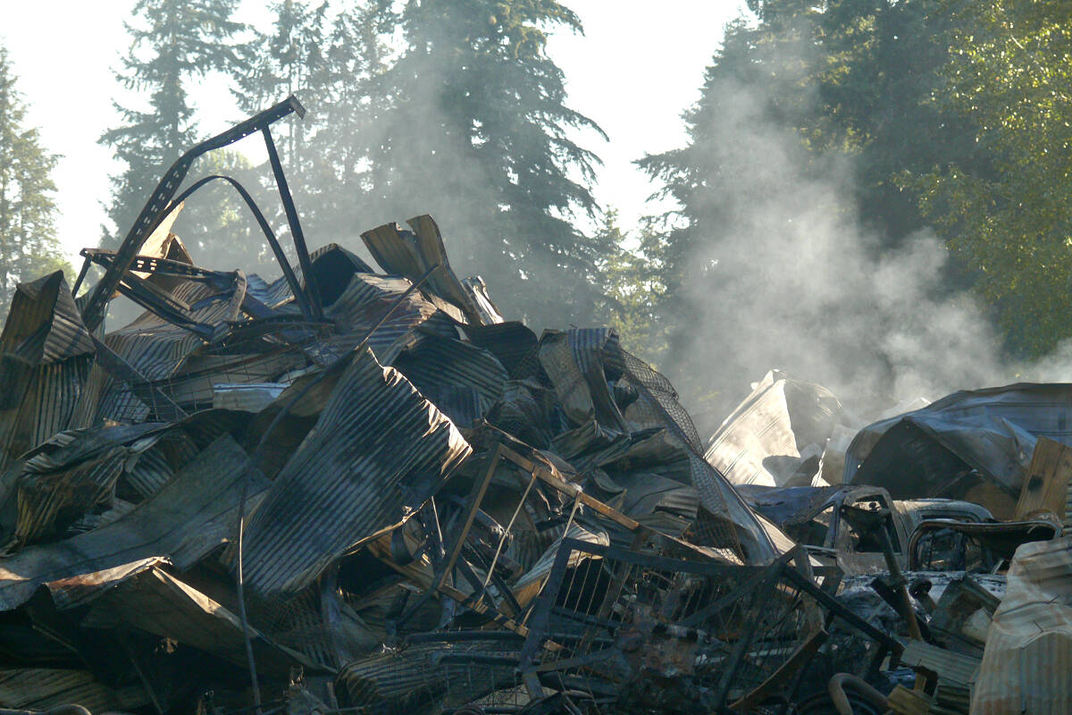 Fire completely destroyed several large farm buildings on 244th Street near 50th Avenue on Sunday, Aug. 28. (Dan Ferguson/Langley Advance Times)