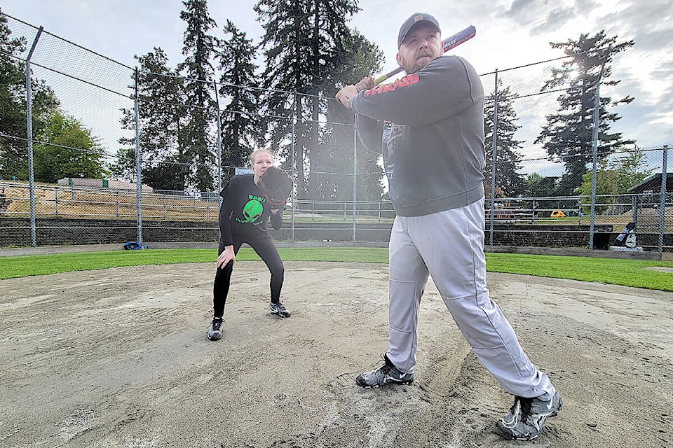 Amanda Hailstone and Todd Reid of Base Invaders (below left) were among 14 teams who participated in the second annual Mangat Softball Memeorial Tournament on Saturday and Sunday at Philip Jackman Park. It raised just more than $6,000 for the Aldergrove family. (Dan Ferguson/Black Press media)