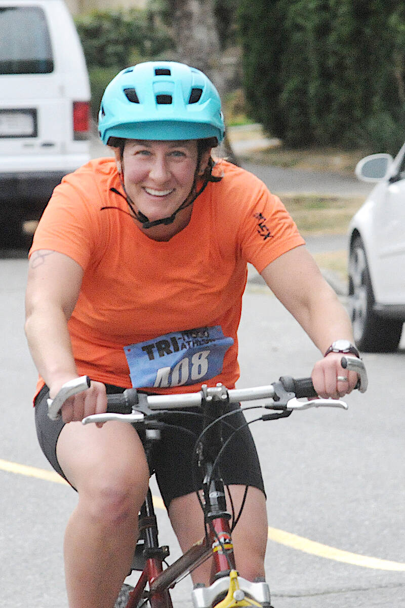 Langleys Laura Ginter, who finished fourth in the female 15-59 category, was beaming during the Tri-It triathlon in Langley City on Satiurday, Sept. 3. (Dan Ferguson/Langley Advance Times)