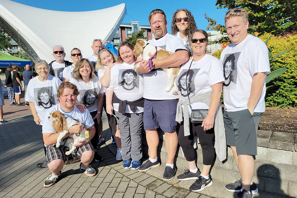 Mike Willemsen (centre, holding dog) and 12 friends and family members took part in the Langley City Terry Fox run on Sunday, Sept. 18. (Dan Ferguson/Langley Advance Times)