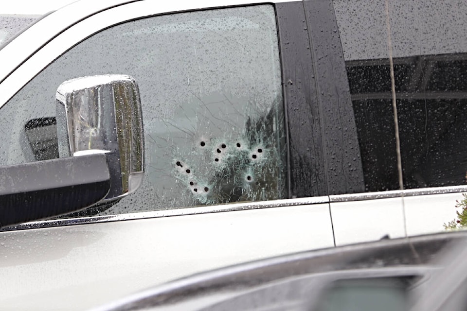A series of bullet holes can be seen in the driver’s side window of an SUV in a Willoughby neighbourhood. Police confirm a man was shot to death Thursday evening (Oct. 20, 2022) (Shane MacKichan/Special to Langley Advance Times)