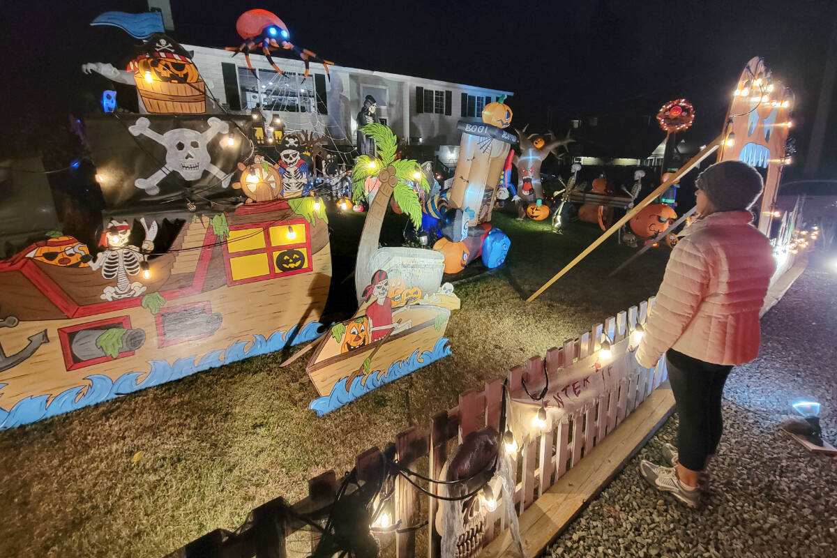 A visitor admired the the Halloween Town display 20504 43rd Avenue, behind George Preston arena. It is open till around 10 p.m. every night through Halloween.(Dan Ferguson/Langley Advance Times)