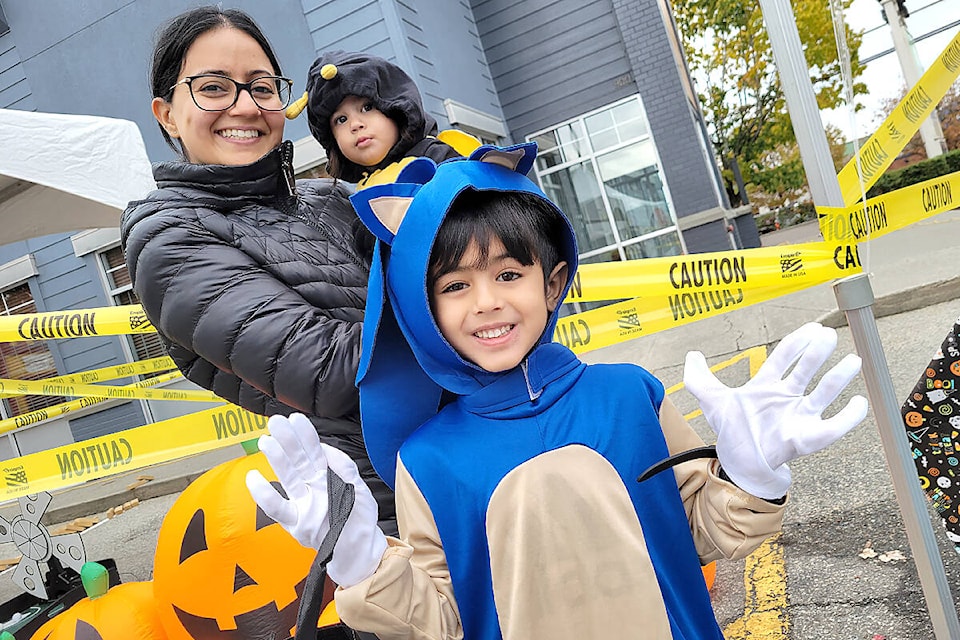 Aldergrove’s Jennifer Manchanda, with her kids Naiya and Aiden, was delighted at the return of the Halloween Hunt at Aldergrove Village Shopping Centre on Saturday, Oct 29. The first post-COVID version of the annual event featured a scavenger hunt, crafts, goodie bags, face painting, popcorn, and games. (Dan Ferguson/Langley Advance Times)
