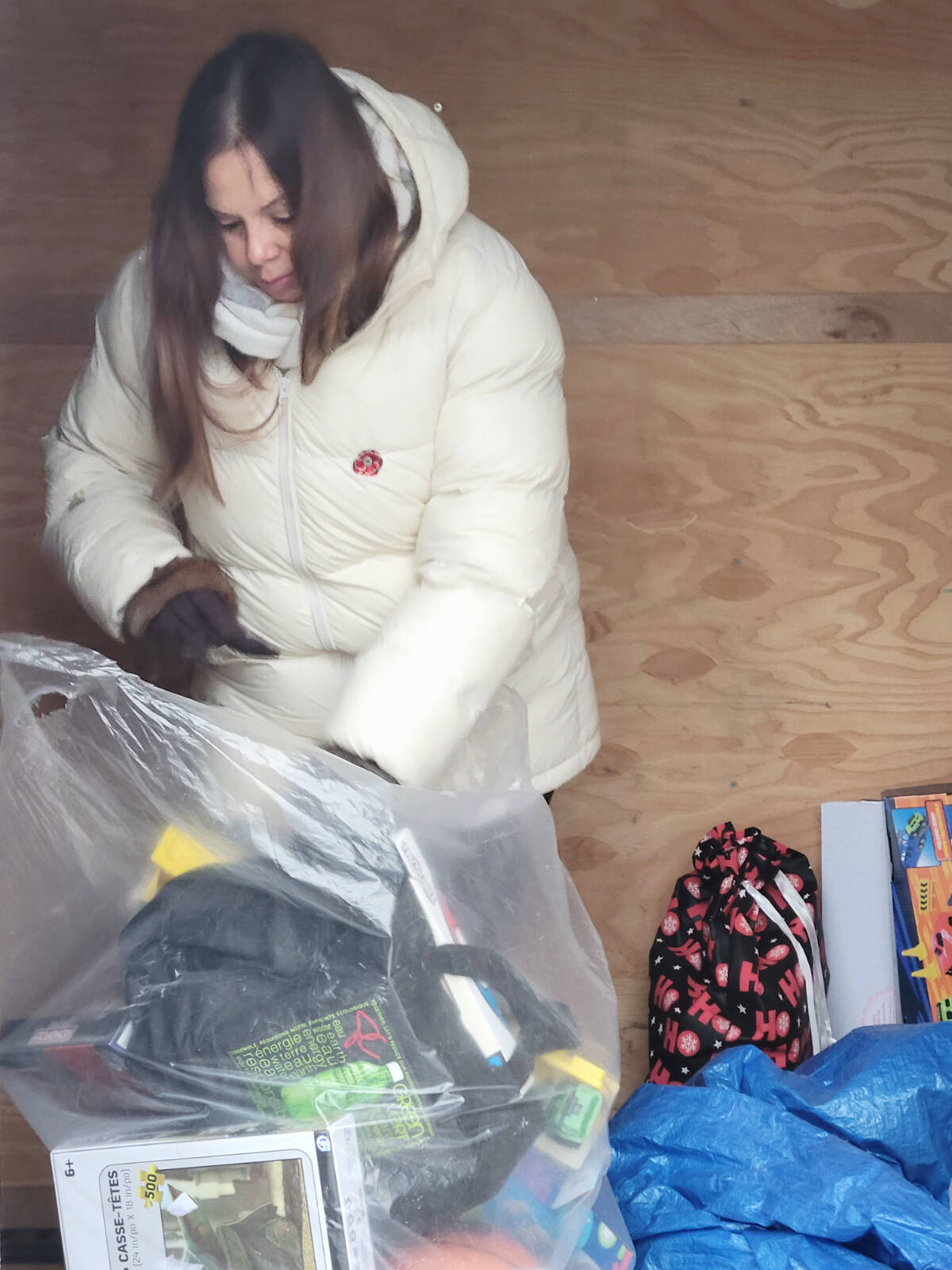 A volunteer loaded toys at the 39th annual Kruise For Kids toy drive held on Sunday, Nov. 6 at the Kwantlen Polytechnic University parking lot in Langley City. While toy contributions were down, cash donations were up. (Dan Ferguson/Langley Advance Times)