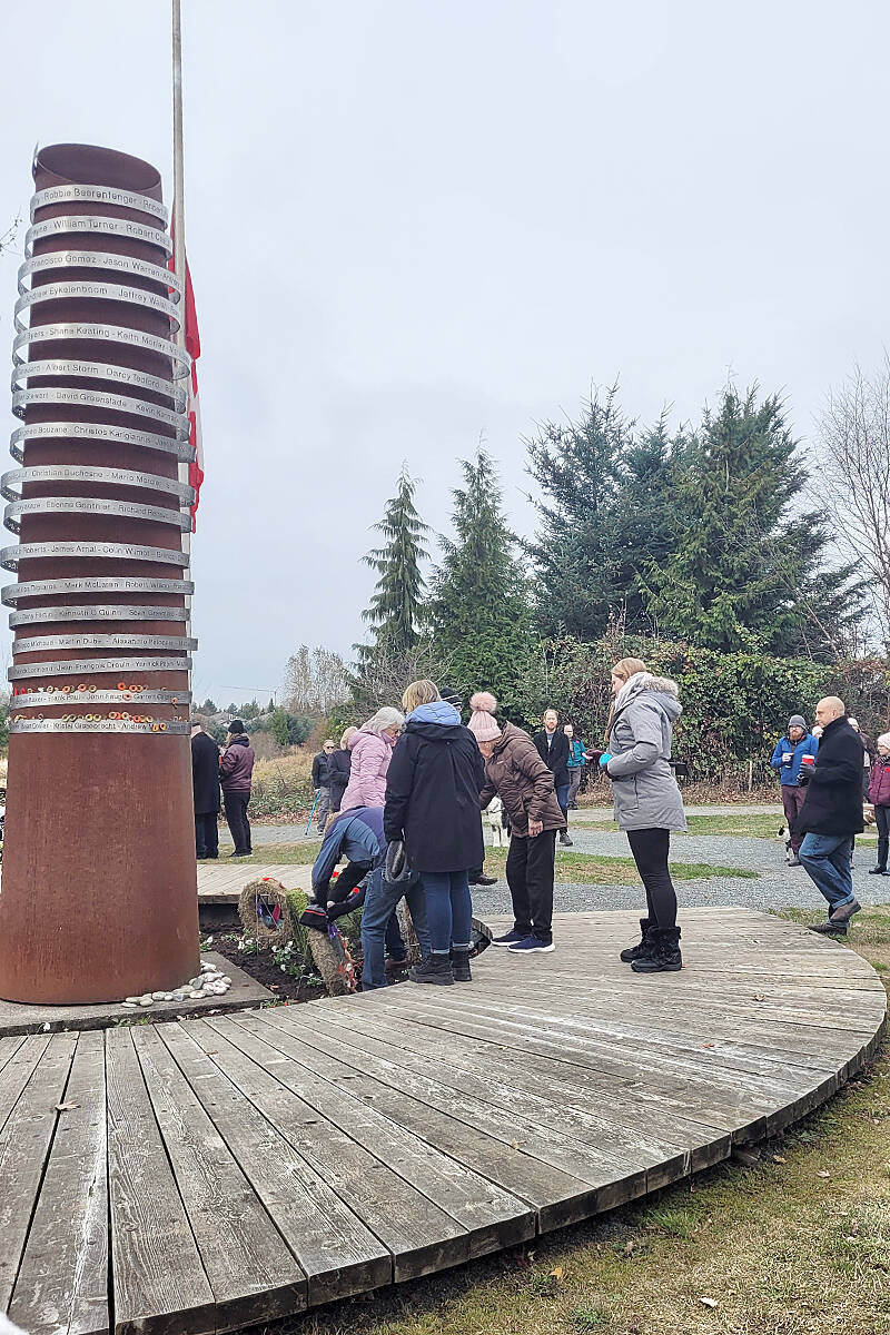 A small group gathered at the Afghanistan war memorial at Derek Doubleday Arboretum in Langley on Remembrance Day. (Leanne Hofsink/Special to Langley Advance Times)