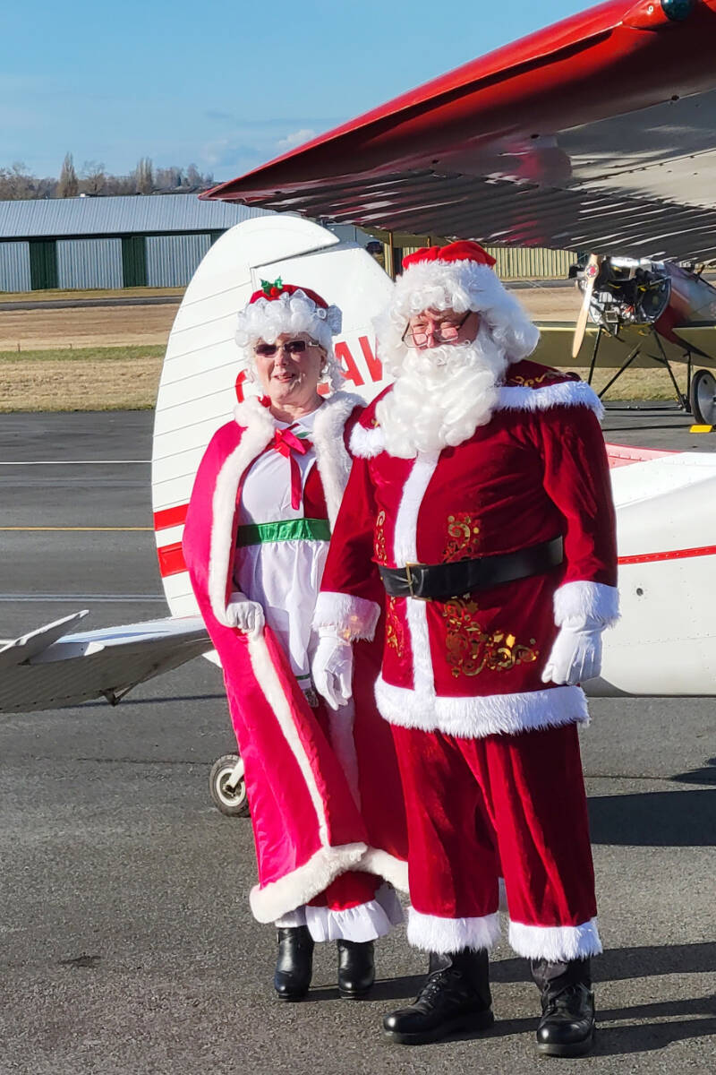 Santa and Mrs. Claus arrived, appropriately, in a plane at the Canadian Museum of Flight in Langley on Sunday, Nov. 27. The chance to see the jolly old elf packed the museum at the airport, with more than 740 kids and adults attending the free event. (Dan Ferguson/Langley Advance Times)