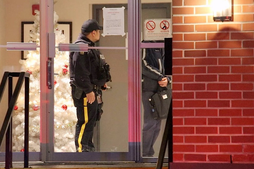 Two people are in hospital and one person is in police custody following a violent incident at a Langley City multi-unit residential building on Friday afternoon, Dec. 2. (Shane MacKichan/Special to Langley Advance Times)