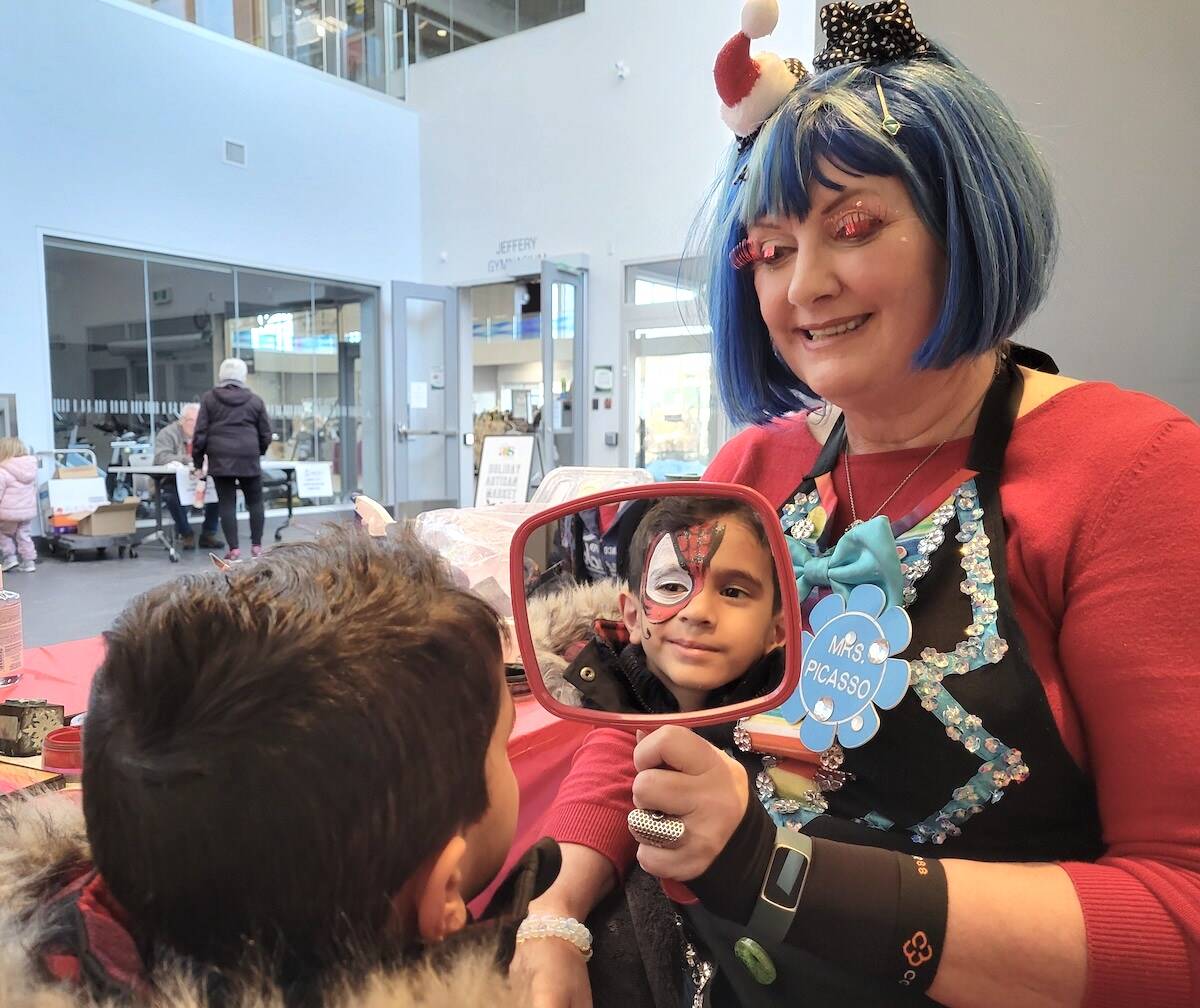 Langley City resident Nolan, 4, checked out the results of a face-painting session with Mrs. Picasso at the Magic of Christmas Festival held at Timms Centre in Langley City Dec. 3-4. (Dan Ferguson/Langley Advance Times)