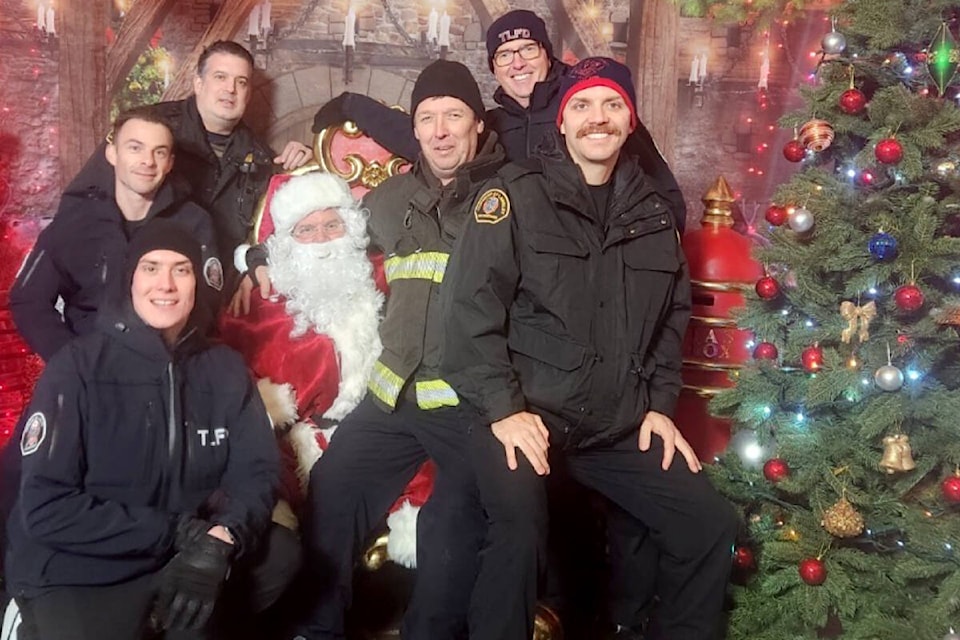 A team of Township of Langley firefighters were at Bright Nights this past Tuesday again, to serve as hosts and greet guests as they came to the charity Christmas event. (TLFCS/Special to Langley Advance Times)