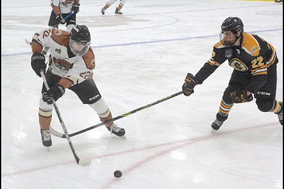 Kodiaks forward Dylan Garland pursued the puck against a Grandview Steelers player on Wednesday, Dec. 14, at Aldergrove Credit Union Community Centre (ACUCC) arena. (Kurt Langmann/Special to Black Press Media)