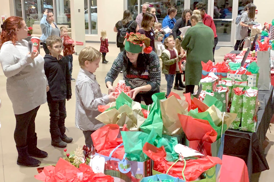A table filled with gifts for children was set up at the Acts of Kindness Christmas dinner for single mothers on Dec. 11, held at Church In The Valley. (Special to The Star)