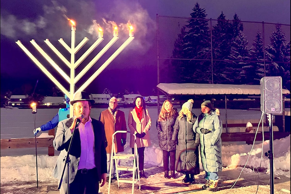 Rabbi Bentzion Schtroks led the Menorah lighting ceremony at the West Langley Hall in Walnut Grove on Tuesday, Dec. 20. (Special to Langley Advance Times)