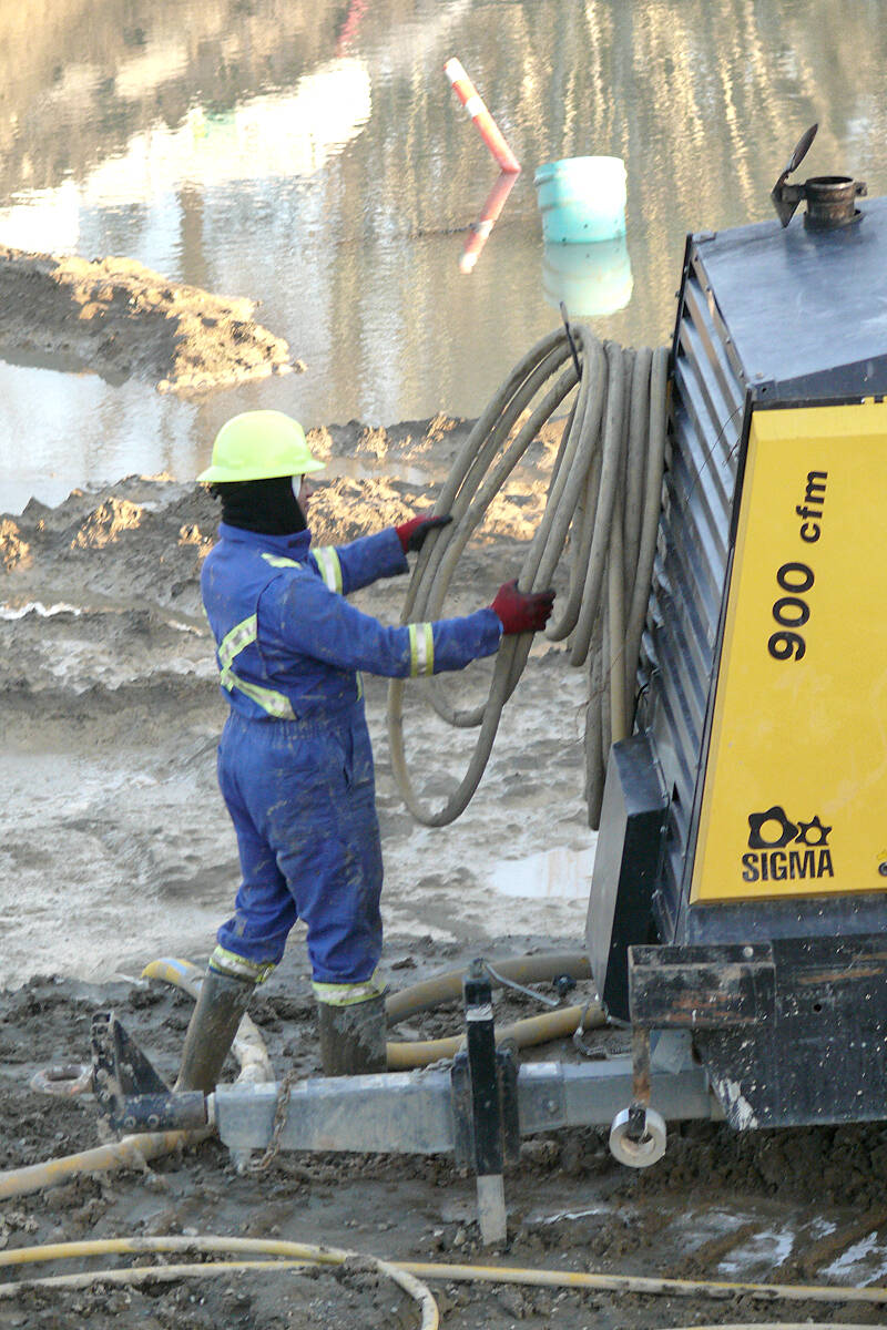 One of the workers at the Alder Grove Town Centre project on Wednesday, Jan. 4. The first three yet-to-be-completed buildings are completely sold out. (Dan Ferguson/Langley Advance Times)