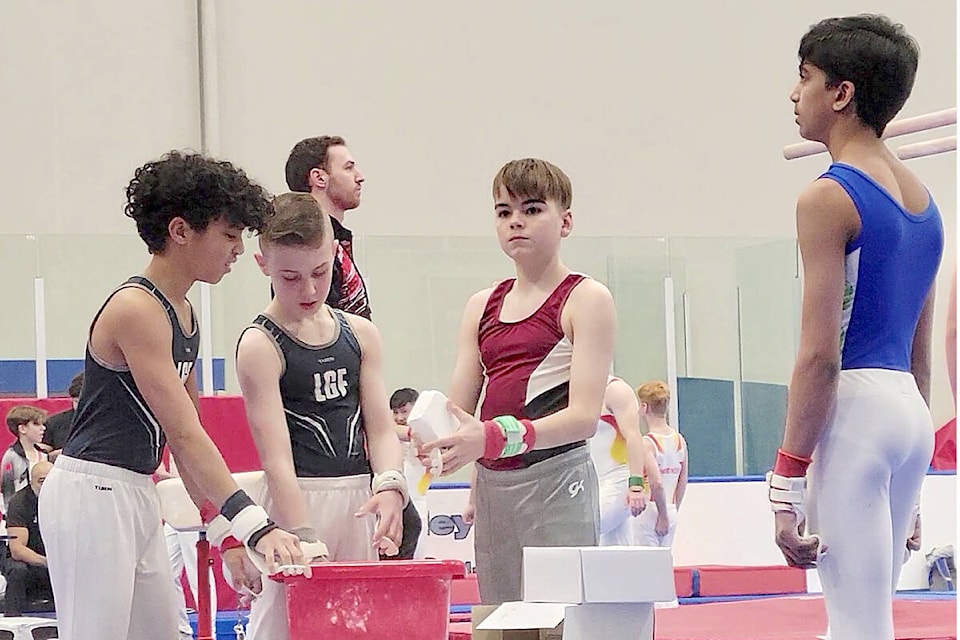 Competitors chalked up on Saturday, Feb. 4, at the 30th annual Christy Fraser Memorial Invitational gymnastics competition held at the Langley Events Centre fieldhouse over four days.(Dan Ferguson/Langley Advance Times)