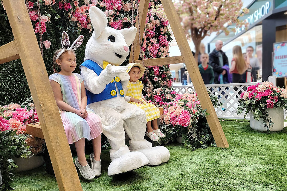 Sisters Chloe, 5, and Sophia, 3, sat for a portrait with the Easter Bunny at Willowbrook Shopping Centre in Langley on Saturday, March 25. Hoppy Days celebration continues till April 8. (Dan Ferguson/Langley Advance Times)