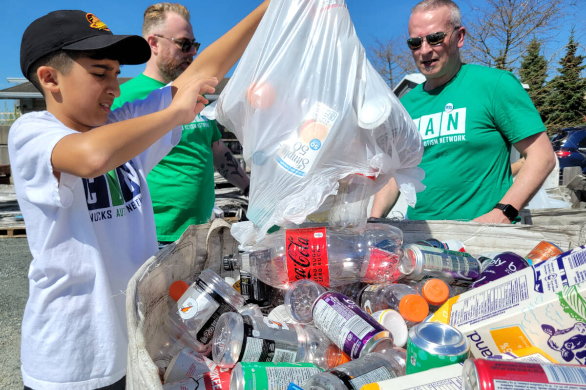 Ethan, 12, was on site helping sort the donated bottles from the drive on Saturday, April 29. (Kyler Emerson/Langley Advance Times)