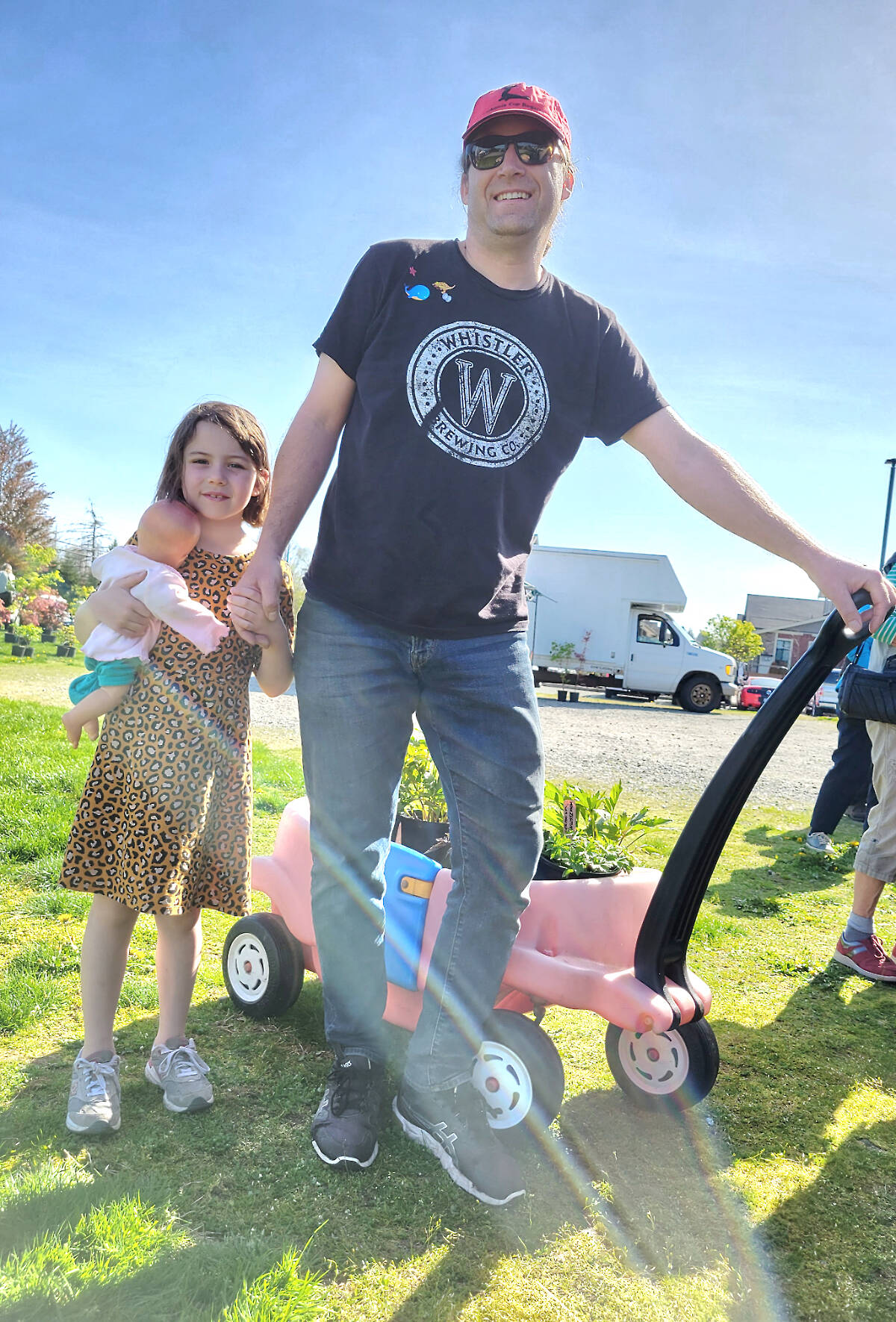 Joel Lancaster and daughter Ruby, 6, came in from Pitt Meadows for the Langley Garden Club annual show and sale on Saturday, April 29, in the parking lot of Southridge Fellowship Church. ( Dan Ferguson/Langley Advance Times)