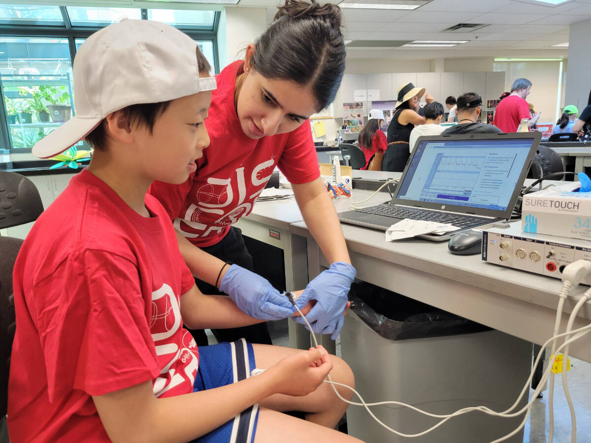 Cayden, 10, from Surrey was asked to relax, then move his arms, to see the different readings on the computer he was connected to. Hundreds of kids turned out for Science Rendezvous at Kwantlen Polytechnic University in Langley City on Saturday, May 13. (Dan Ferguson/Langley Advance Times)