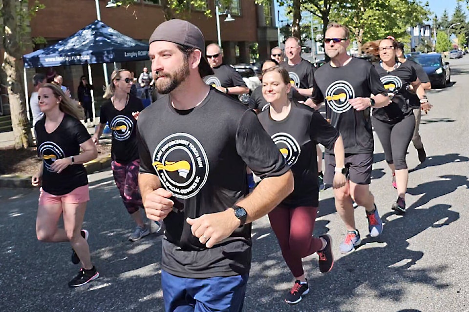 About two dozen runners turned out for the return of the Law Enforcement Torch Run for Special Olympics BC in Langley on Tuesday, June 6. (Dan Ferguson/Langley Advance Times)