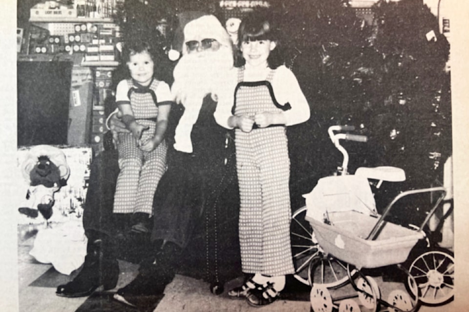 'It's Beginning To Look A Lot Like Christmas' (Dec. 11, 1974): 'Tammy Donovan (l) and sister Kathy were two of the many children to see and enjoy Santa Claus at D&C Hardware in Ashcroft last Wednesday.'