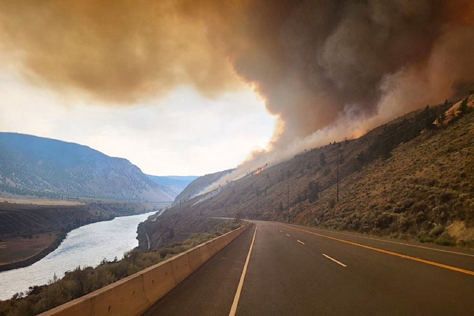 Flames from the Shetland Creek wildfire approaching Highway 1 north of Spences Bridge. The highway is now closed from Spences Bridge to Ashcroft.