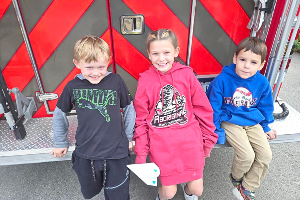 (from l) Austyn Harkness, Ava Kennedy, and Wyatt Porter were this year's Firefighters for a Day in Cache Creek, and had a special day on Oct. 11.