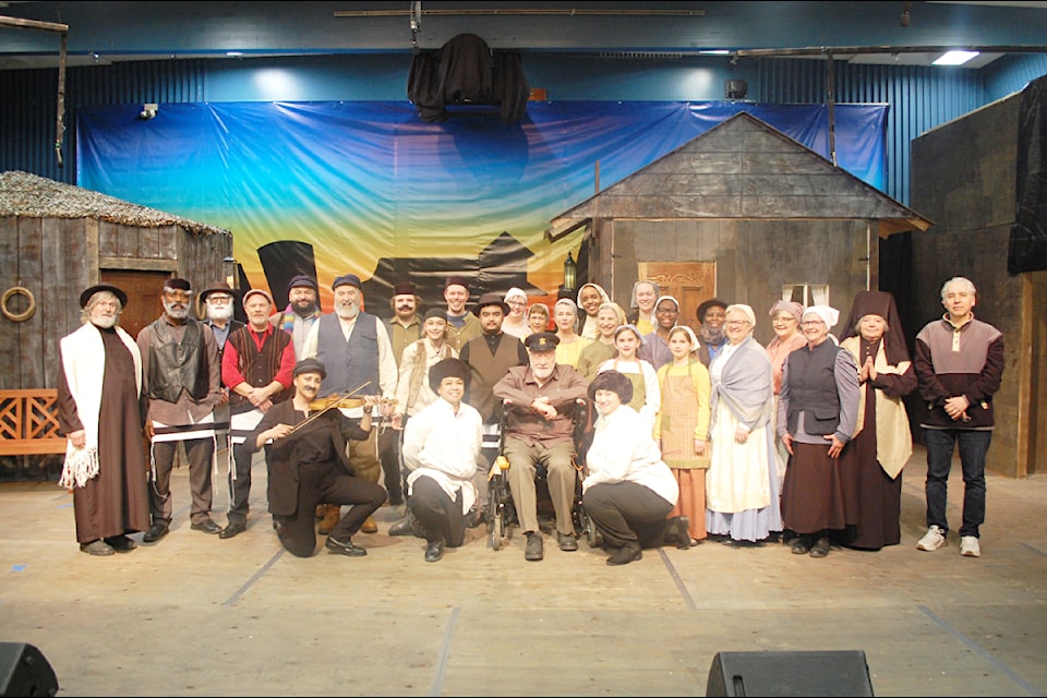 The cast of the upcoming production of 'Fiddler on the Roof' on stage at the Ashcroft HUB for the first dress rehearsal on March 25. Producer, director, and music director Michelle Reid is third from right, accompanist Dimiter Terziev is at far right, and Jim Mertel as Tevye the Milkman is sixth from left (standing).