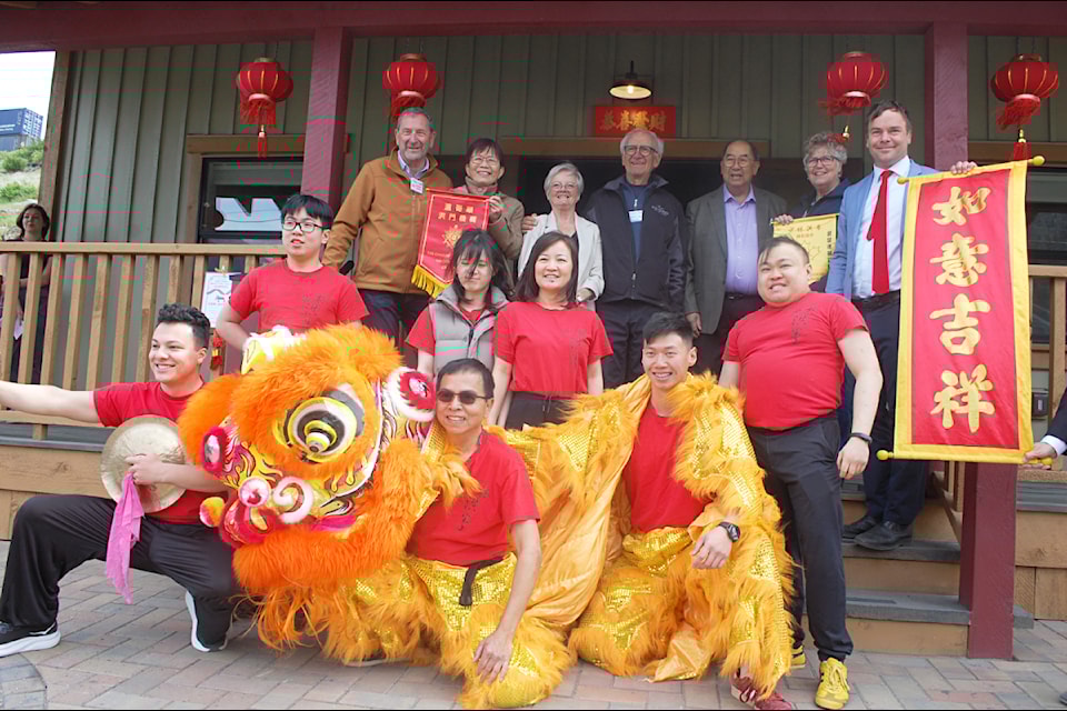 Members of the Shao Lin Hung Gar Lion Dance team (front rows) with (back row from l) MLA Tony Luck; MLA Teresa Wat; Lorna Fandrich; Bernie Fandrich; Don Chow; Lytton mayor Denise O'Connor; and MLA Spencer Chandra Herbert at the opening of the newly-rebuilt Lytton Chinese History Museum on May 3.