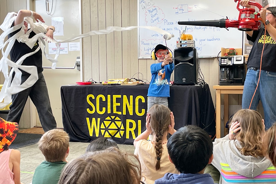 Look at it go! A student gets an up-close demonstration of force and motion during an event at the Ashcroft Library on May 3. 