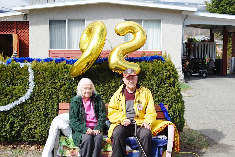 Rod Craggs (r) and his wife Barnie outside their Ashcroft home on the occasion of Rod's 92nd birthday in 2020, when a convoy of three dozen vehicles drove past to wish him well.
