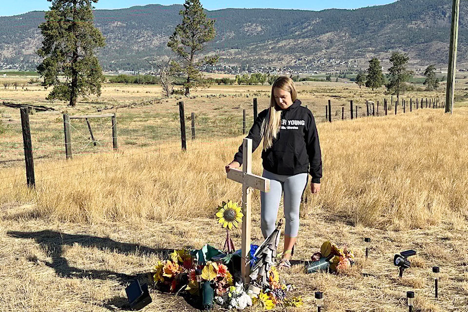 Alix Legouffe stands beside a roadside memorial to her brother, Buddy Rhodes, whose body was found beside the Coquihalla Highway near Merritt on Aug. 30, 2024.