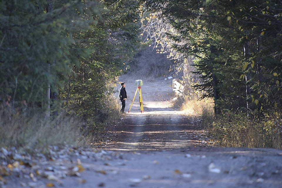 9130456_web1_171101-silver-creek-cop-on-road-to-bridge-DSC_0644