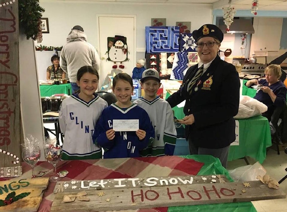 9643095_web1_171205-ACC-M-1st-Annual-Christmas-Artisans-Bazaar--Marian-Nelson-presents-the-Youth-Club-with-a-cheque-from-the-Legion---Photo-by-Karen-Miller