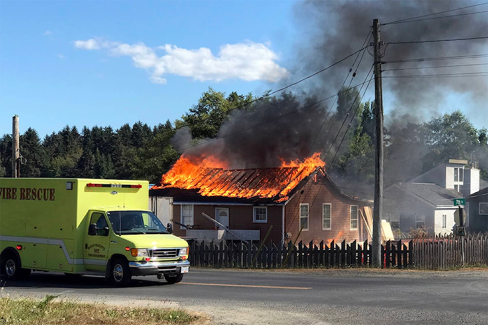 Bystanders said what began as a spot fire soon engulfed the roof and spread inside when it was fanned by the wind. (Fran Fowler/Submitted)