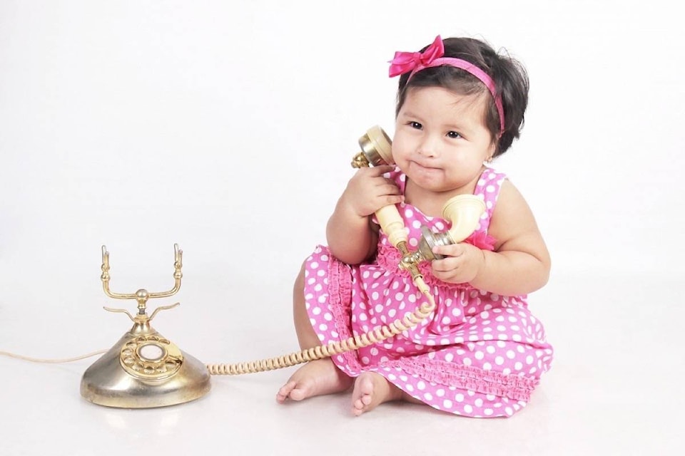 16304988_web1_190409-ACC-M-Child-on-rotary-phone
