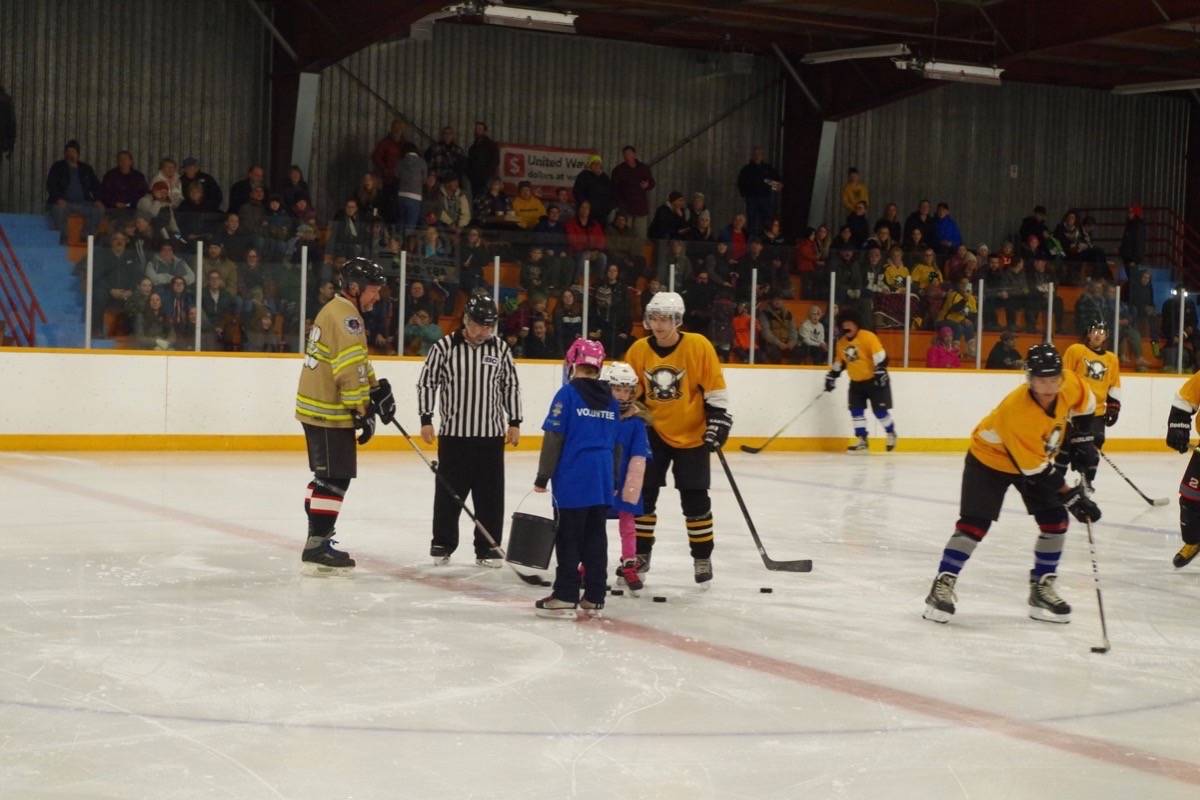 20133324_web1_200114-ACC-M-Hockey-puck-cleanup-Josh-White