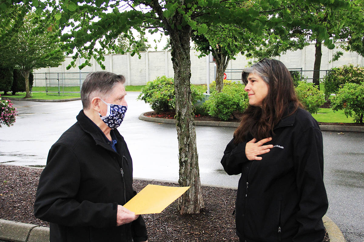 Johnny Forrest chats with Natalie White. White’s son Andrew Futerko was killed when his motorcycle collided with Johnny Forrest’s SUV late in the evening of June 20, 2018. White always had questions about the accident and wanted to meet with Forrest to talk about what happened that night. (Photo: Malin Jordan)