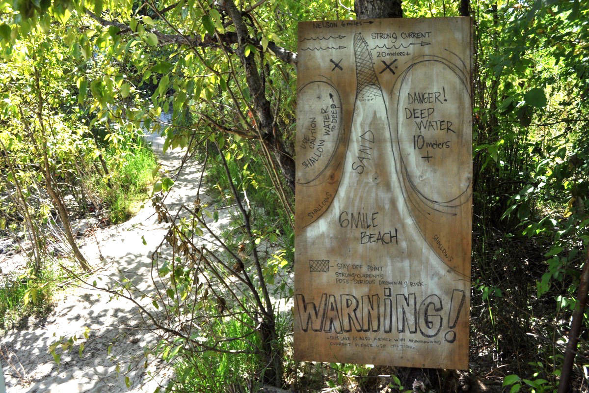 In the days after the death, Six Mile residents put up signs on the path to the beach warning of the danger. Photo: Tyler Harper