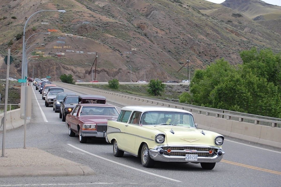 Cars in the 2020 Graffiti Days classic car cruise head over the bridge into Ashcroft. (Photo credit: Barbara Roden)