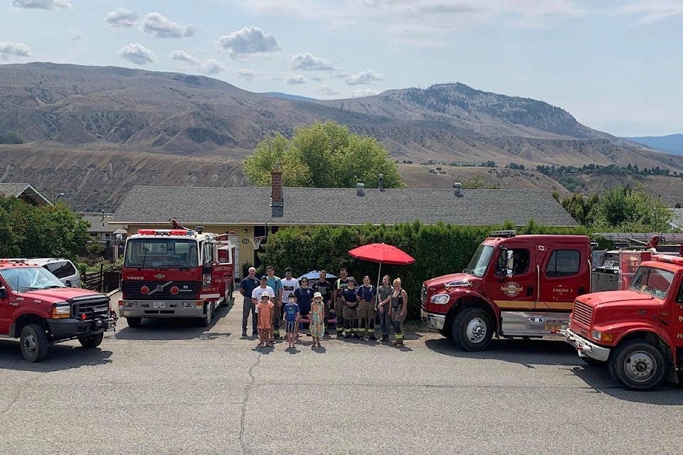 Members of the Ashcroft Volunteer Fire Department at a Lytton fundraiser in Ashcroft run by Michaela Aie (front row, l) with helpers Ryan Monford and Preslee Duncan. (Photo credit: Heather White-Aie)