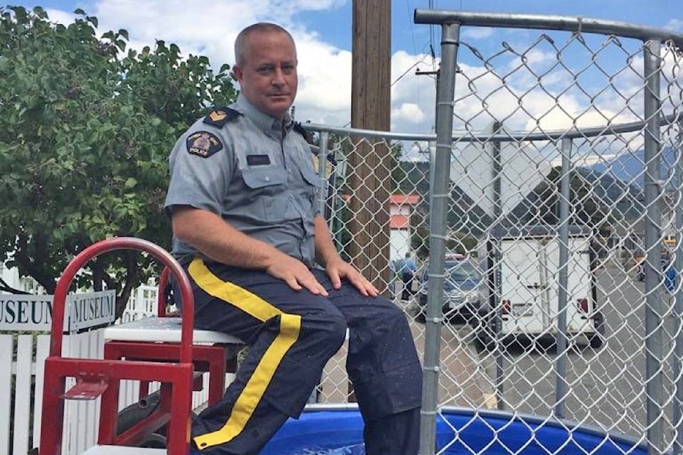 Former Lytton RCMP detachment commander Sgt. Curtis Davis in the dunk tank at the Lytton Rivers festival in September 2018. (Photo credit: Lytton RCMP)