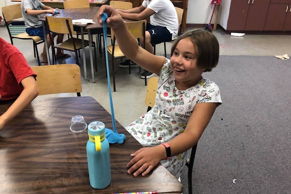 A happy participant in one of the HUB summer camps shows off her creation. (Photo credit: Ashcroft HUB)