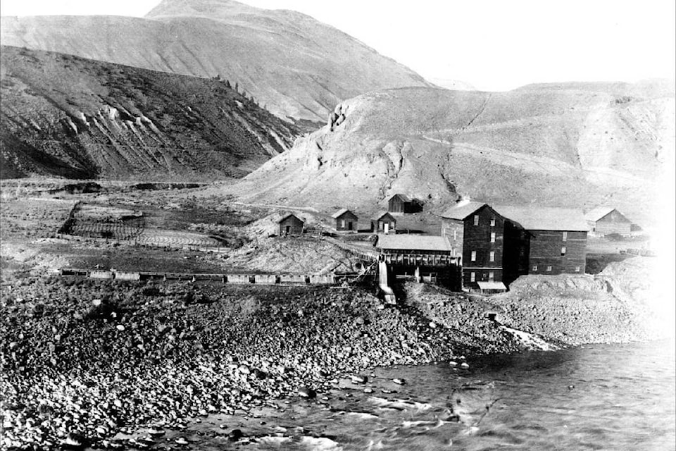 Harper’s Mill on the Bonaparte River, pictured in the 1890s. The road connecting the site to the Cariboo Waggon Road can be seen in the background. (Photo credit: Ashcroft Museum and Archives)