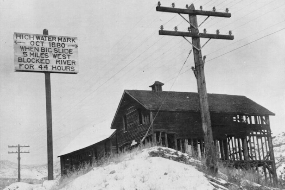 A photograph from the 1930s shows a wooden sign beside what remained of Harper’s Mill. That sign is still there, beside the CN track that runs past the mill site, and another sign, which is now in the Ashcroft Museum, can be seen on the front of the building at centre. (Photo credit: Ashcroft Museum and Archives)