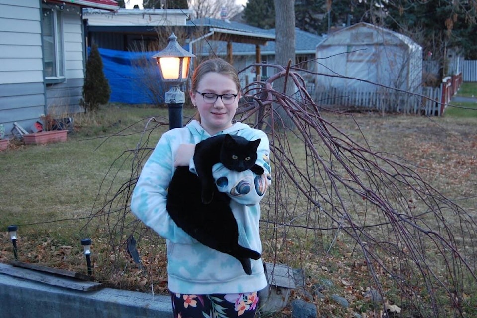 Kendra Taylor and her cat Twilight, who disappeared from Cache Creek on Sept. 21 and was turned in to the Port Coquitlam SPCA nearly two months later. (Photo credit: Barbara Roden)